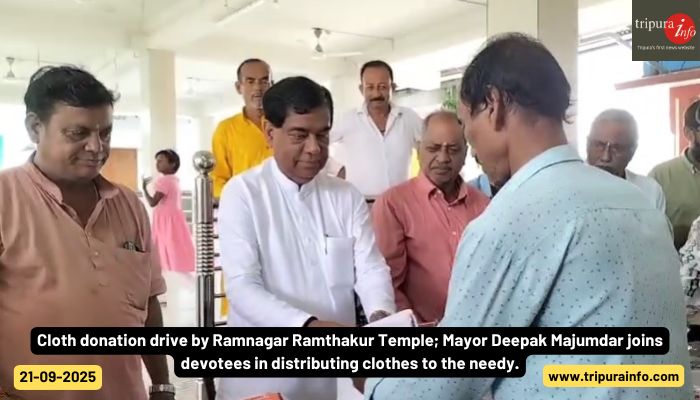 Cloth donation drive by Ramnagar Ramthakur Temple; Mayor Deepak Majumdar joins devotees in distributing clothes to the needy.