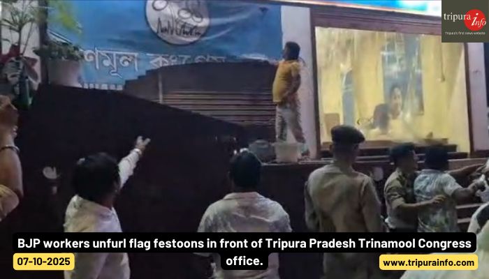 BJP workers unfurl flag festoons in front of Tripura Pradesh Trinamool Congress office.